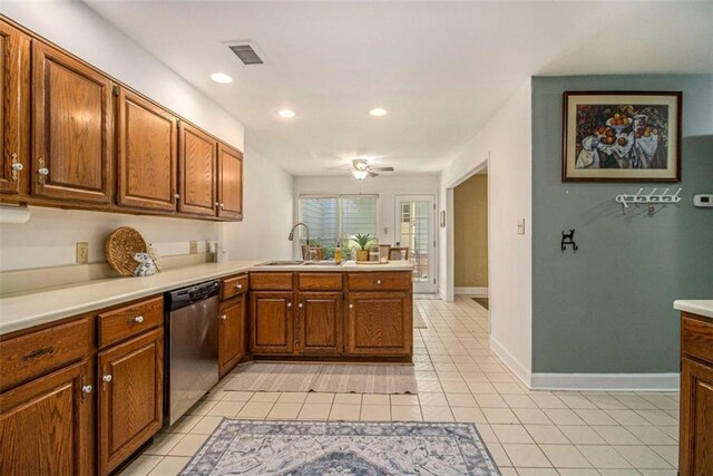 1484 Winston Pl, Decatur, GA 30033 - kitchen with a peninsula, light countertops, dishwasher, and light tile patterned flooring