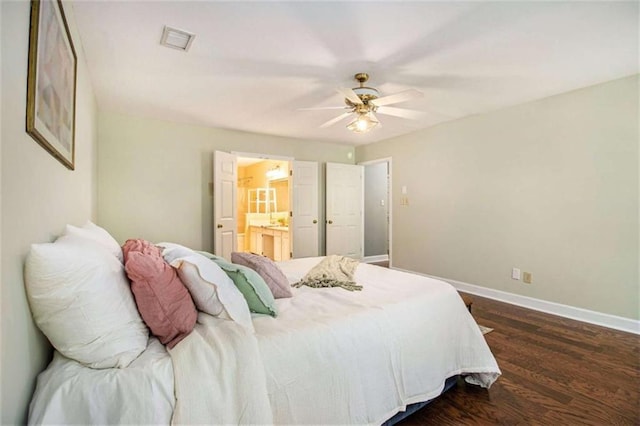 1484 Winston Pl, Decatur, GA 30033 - bedroom with visible vents, baseboards, a ceiling fan, connected bathroom, and dark wood-type flooring