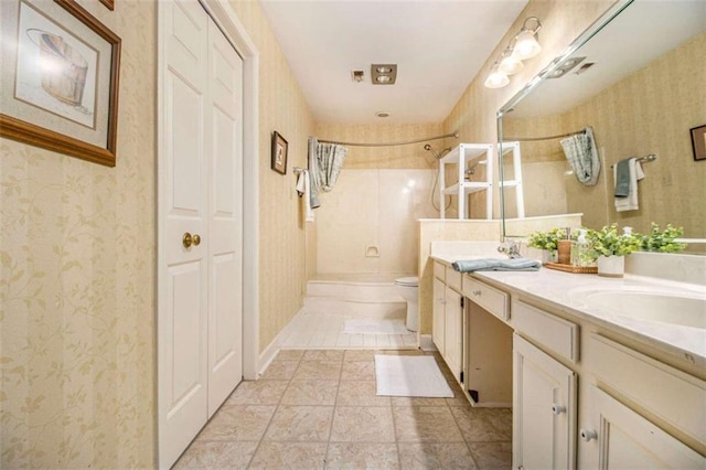 1484 Winston Pl, Decatur, GA 30033 - bathroom featuring wallpapered walls, a closet, double vanity, a shower, and toilet