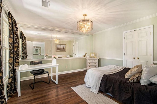 1484 Winston Pl, Decatur, GA 30033 - bedroom featuring visible vents, baseboards, a notable chandelier, wood finished floors, and ornamental molding