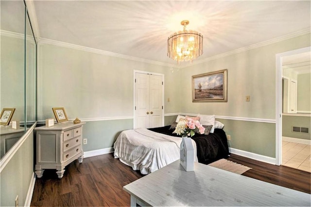 1484 Winston Pl, Decatur, GA 30033 - bedroom with baseboards, visible vents, a chandelier, crown molding, and dark wood-type flooring