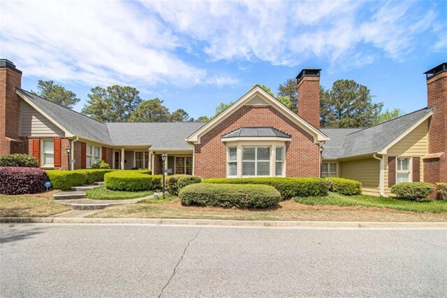 1484 Winston Pl, Decatur, GA 30033 - view of front of home with a chimney and brick siding