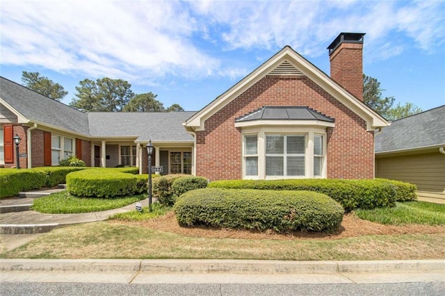 1484 Winston Pl, Decatur, GA 30033 - view of front of home with a chimney and brick siding