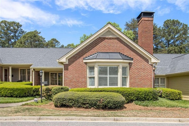 1484 Winston Pl, Decatur, GA 30033 - view of front of home with a chimney and brick siding