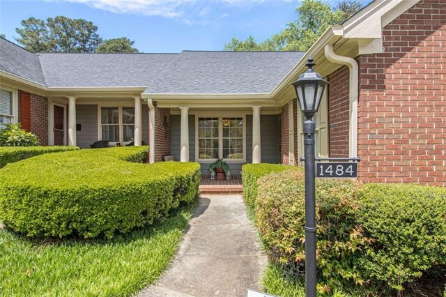 1484 Winston Pl, Decatur, GA 30033 - view of exterior entry with covered porch and brick siding