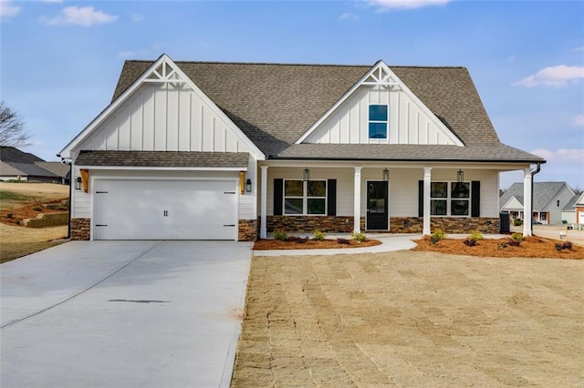 view of front of house featuring covered porch and a garage