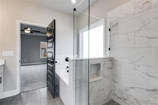 bathroom with tile patterned floors, ceiling fan, shower with separate bathtub, and vanity