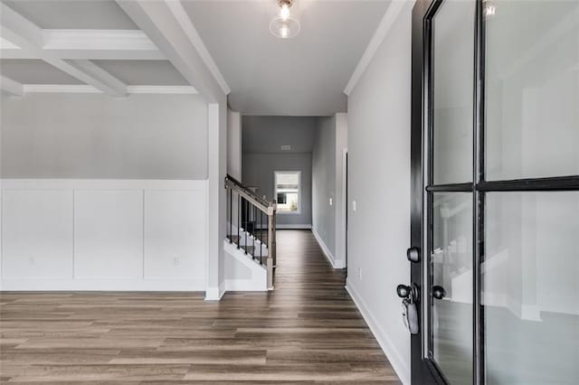 entrance foyer featuring beamed ceiling, hardwood / wood-style flooring, and coffered ceiling