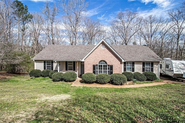 ranch-style house featuring a front yard