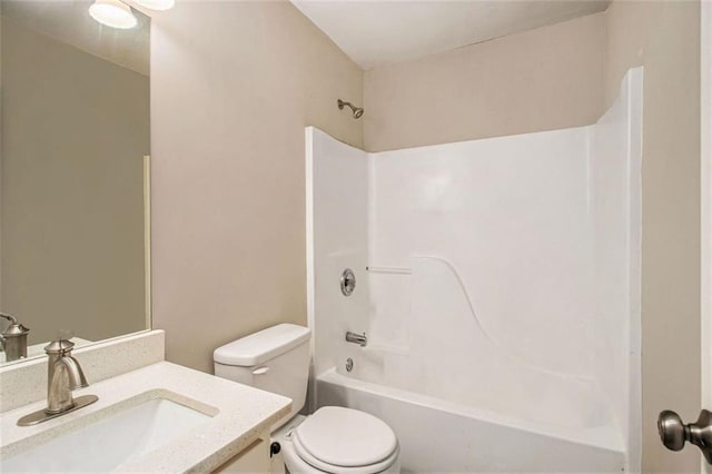 full bathroom with shower / tub combination, vanity, and toilet