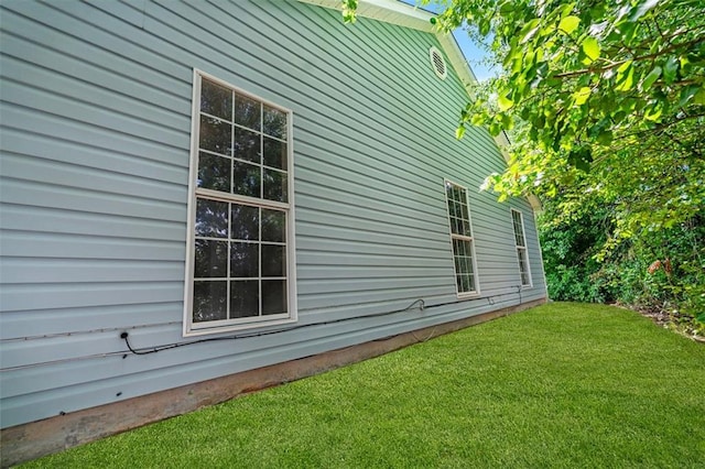 view of home's exterior featuring a lawn