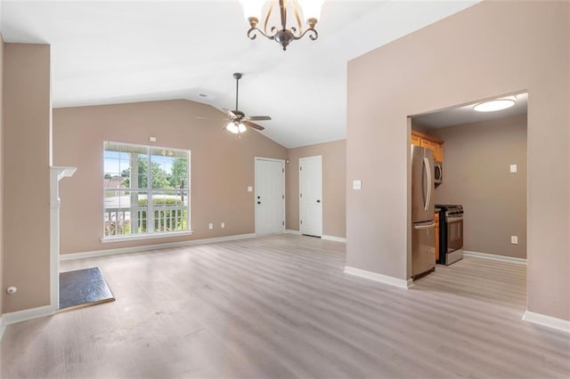 unfurnished living room featuring baseboards, visible vents, ceiling fan with notable chandelier, vaulted ceiling, and light wood-type flooring