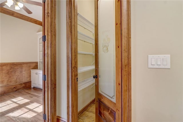 corridor with light wood-type flooring