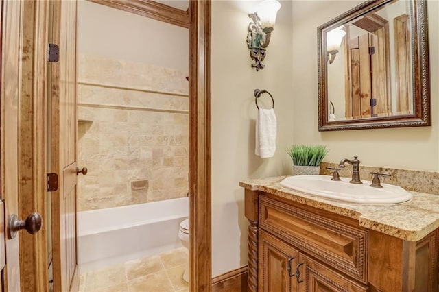 bathroom featuring vanity, tile patterned floors, and toilet