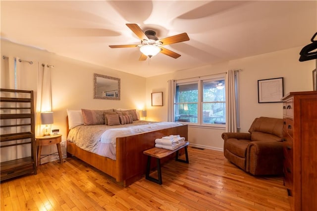 bedroom featuring light hardwood / wood-style flooring and ceiling fan