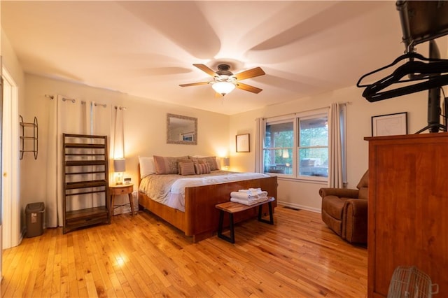 bedroom featuring light hardwood / wood-style flooring and ceiling fan