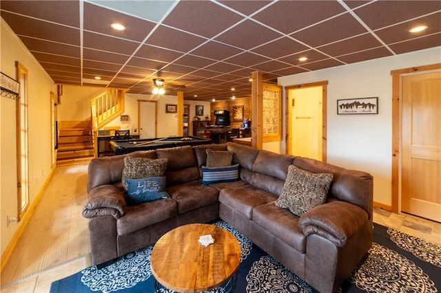 living room with a drop ceiling and billiards