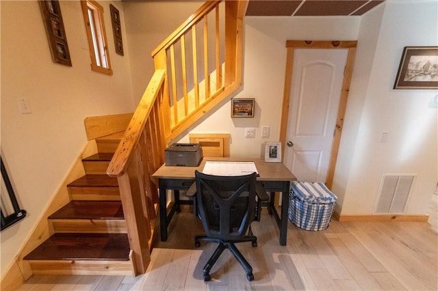 stairs with hardwood / wood-style floors