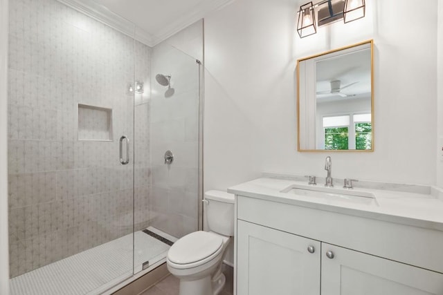 bathroom with tile patterned floors, walk in shower, toilet, vanity, and ornamental molding