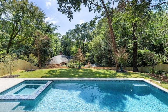 view of swimming pool featuring a lawn