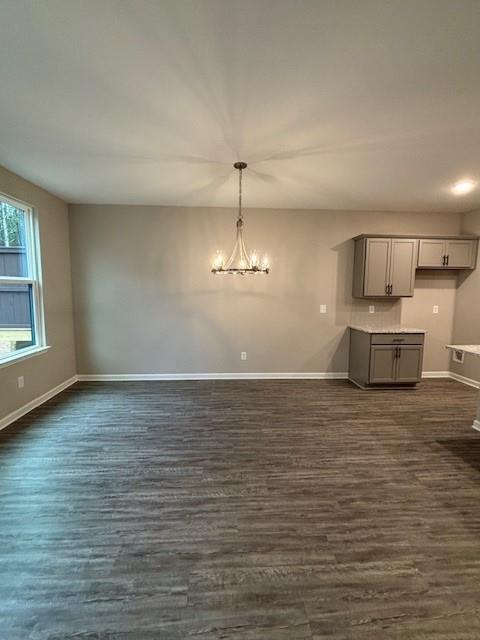 dining room with ceiling fan with notable chandelier