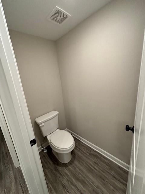 spacious closet featuring dark hardwood / wood-style flooring