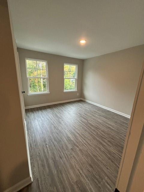 bathroom with hardwood / wood-style floors and toilet