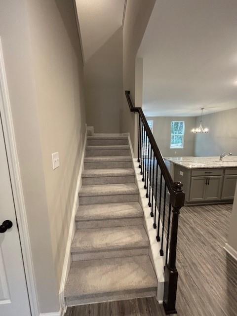 hallway featuring ornamental molding and dark hardwood / wood-style floors