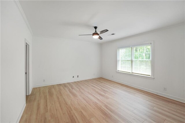 3649 Peachtree Rd NE Unit 305, Atlanta, GA 30319 - unfurnished room featuring crown molding, light wood finished floors, a ceiling fan, and baseboards
