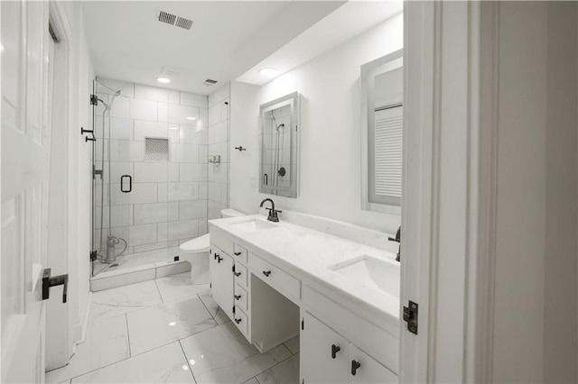 3649 Peachtree Rd NE Unit 305, Atlanta, GA 30319 - bathroom featuring a shower stall, double vanity, marble finish flooring, toilet, and recessed lighting