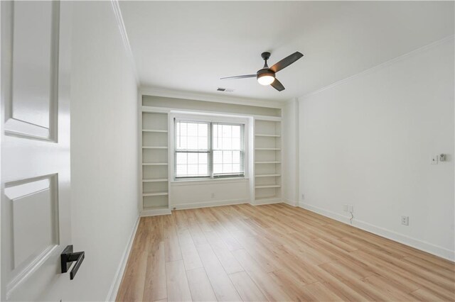 3649 Peachtree Rd NE Unit 305, Atlanta, GA 30319 - empty room featuring crown molding, light wood-type flooring, ceiling fan, and baseboards