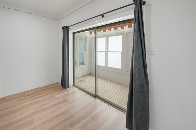 3649 Peachtree Rd NE Unit 305, Atlanta, GA 30319 - empty room featuring ornamental molding, light wood finished floors, and baseboards