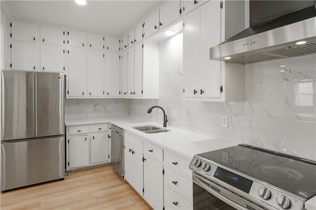 3649 Peachtree Rd NE Unit 305, Atlanta, GA 30319 - kitchen with stainless steel appliances, extractor fan, a sink, backsplash, and white cabinets