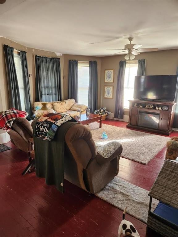 living room featuring ceiling fan and hardwood / wood-style floors