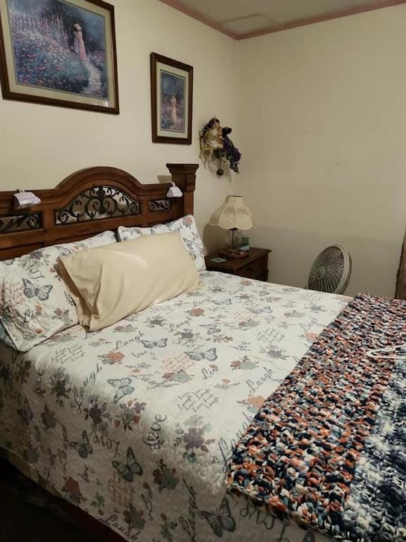 bedroom featuring crown molding