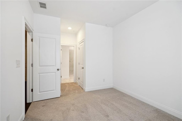 unfurnished bedroom with light carpet