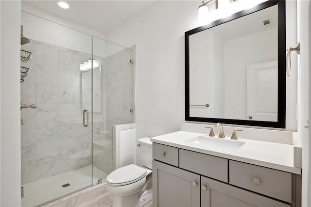 bathroom featuring toilet, walk in shower, and vanity