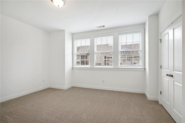 spare room with carpet flooring