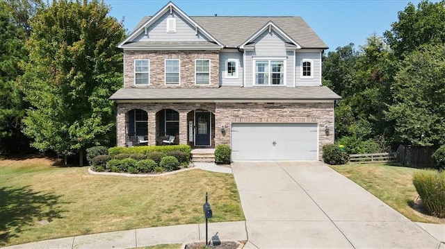 view of front of house featuring a front yard and a garage