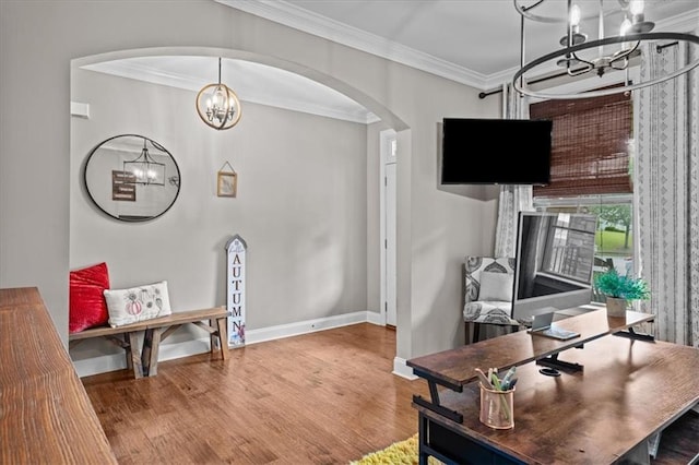 home office featuring crown molding, wood-type flooring, and a notable chandelier