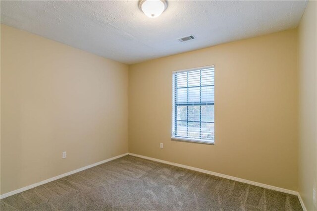 1841 Northwick Pl, Lithonia, GA 30058 - spare room with carpet floors and a textured ceiling