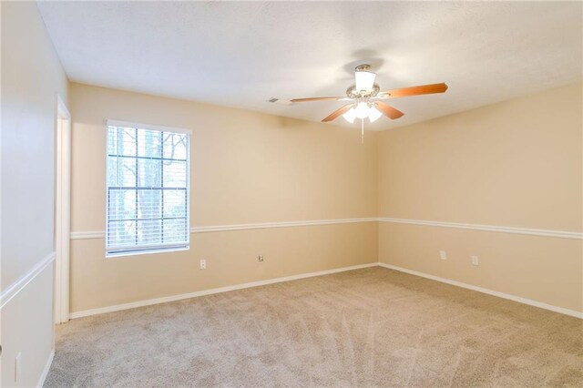 1841 Northwick Pl, Lithonia, GA 30058 - spare room with ceiling fan and light carpet