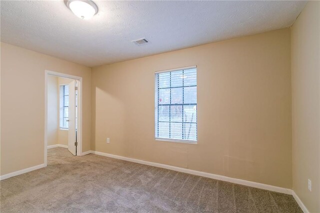 1841 Northwick Pl, Lithonia, GA 30058 - unfurnished room with light colored carpet and a textured ceiling