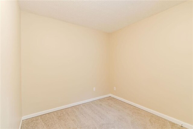 1841 Northwick Pl, Lithonia, GA 30058 - unfurnished room featuring carpet and a textured ceiling