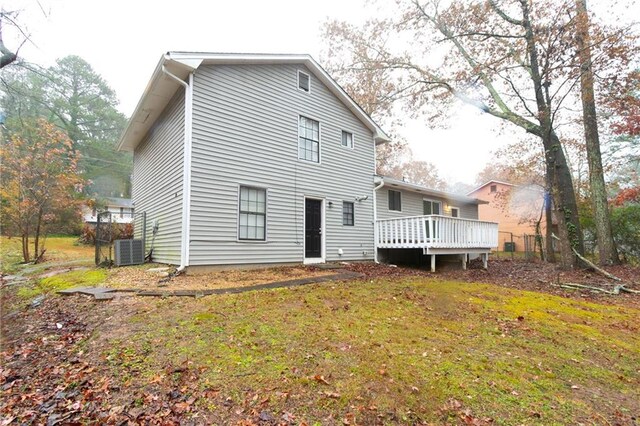 1841 Northwick Pl, Lithonia, GA 30058 - back of property with central AC unit, a yard, and a wooden deck
