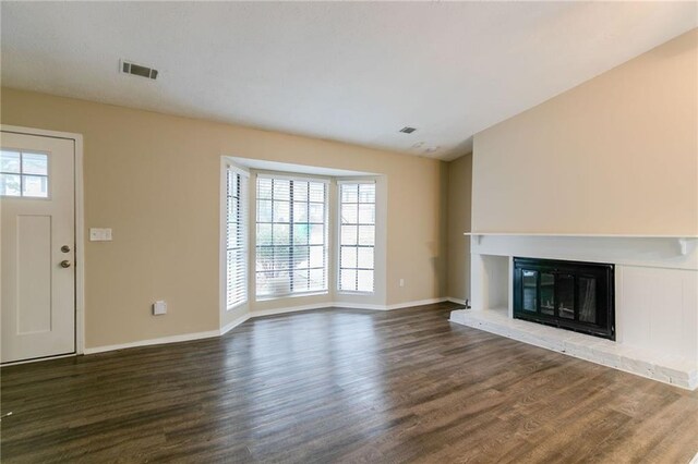 1841 Northwick Pl, Lithonia, GA 30058 - unfurnished living room with dark wood-type flooring and a healthy amount of sunlight