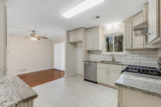 kitchen featuring a sink, ventilation hood, visible vents, and stainless steel appliances