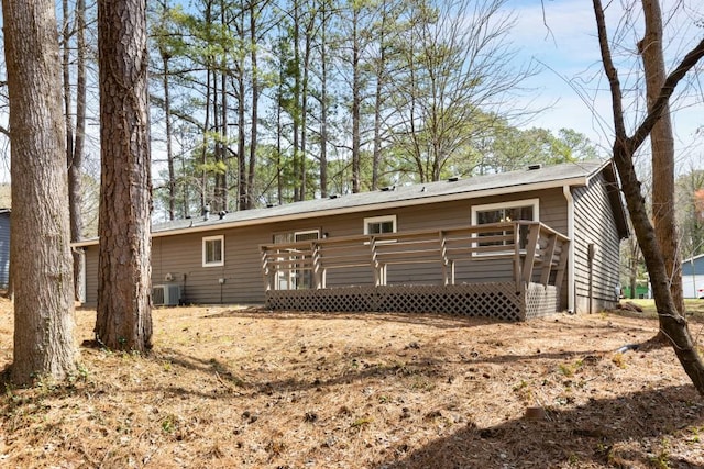 back of property featuring a deck and central AC unit