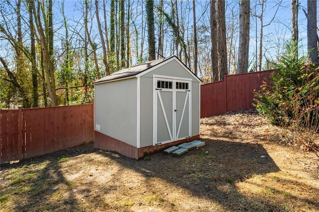 view of shed with a fenced backyard