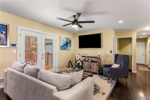 living area with french doors, recessed lighting, dark wood finished floors, and baseboards